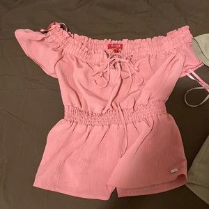 Super cute shirts by guess. (2 pack) Was a gift and they are too small for me